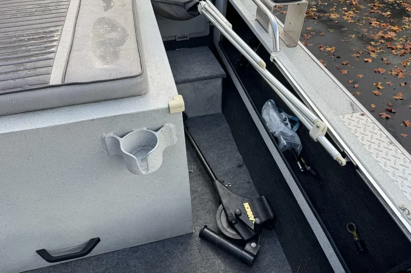 Slide: The Image of Interior of a 1994 Jetcraft Yukon boat with seating and equipment storage. - 21