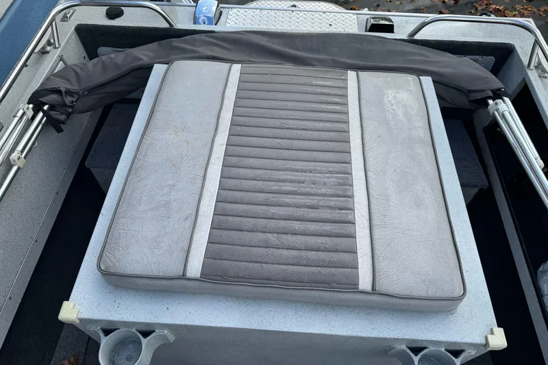 Slide: The Image of 1994 Jetcraft Yukon boat interior with cushioned seating and metal railings. - 23