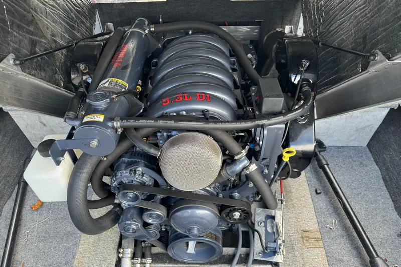 Slide: The Image of Engine of a 1994 Jetcraft Yukon boat, featuring a 5.3L DI motor. - 24