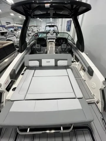 Slide: The Image of 2025 Chaparral 26 Surf boat interior with sleek seating and modern design. - 4