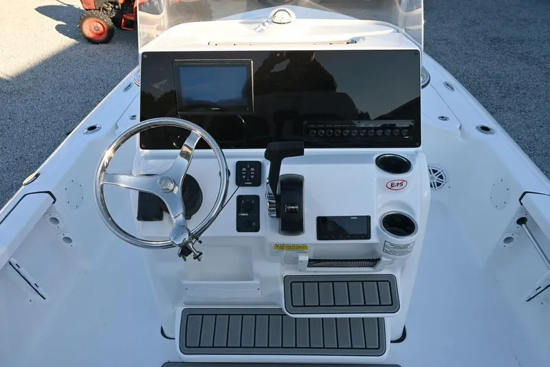 Slide: The Image of 2026 Tidewater 2110 Bay Max boat console with steering wheel and control panel. - 10
