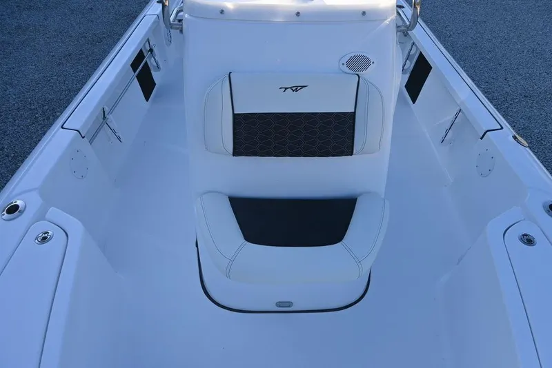Slide: The Image of 2026 Tidewater 2110 Bay Max boat interior with cushioned seating and sleek design. - 15