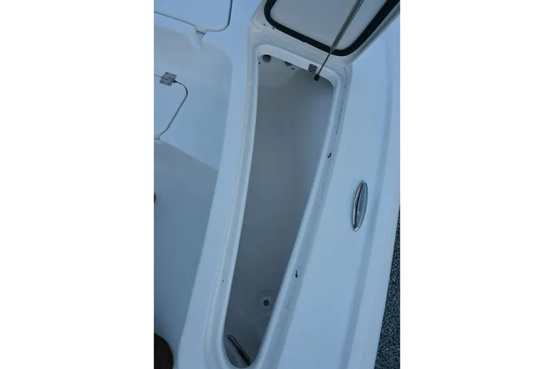 Slide: The Image of Open storage compartment on 2026 Tidewater 2110 Bay Max boat. - 17