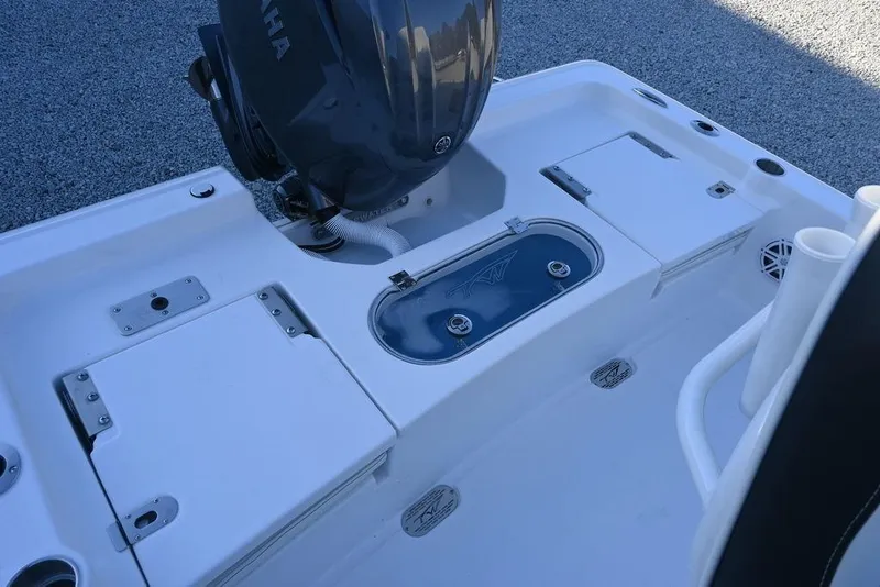 Slide: The Image of 2026 Tidewater 2110 Bay Max boat deck with Yamaha engine and storage compartments. - 18