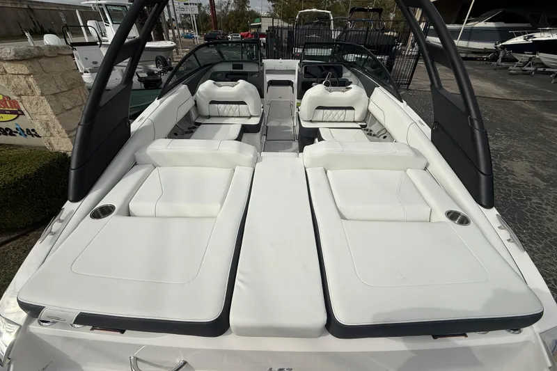 Slide: The Image of 2026 Regal LS2 boat with luxurious white seating and sleek design. - 10