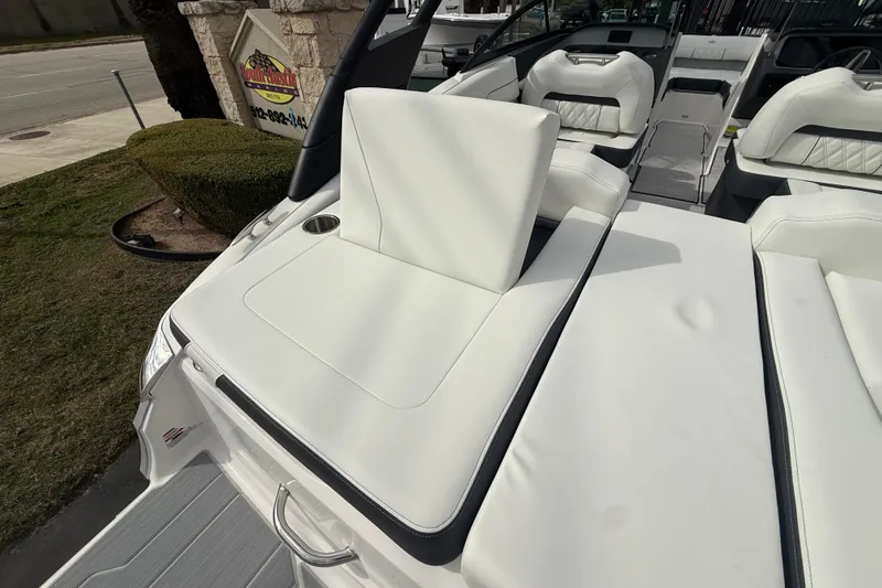 Slide: The Image of 2026 Regal LS2 boat with luxurious white seating and sleek design. - 11