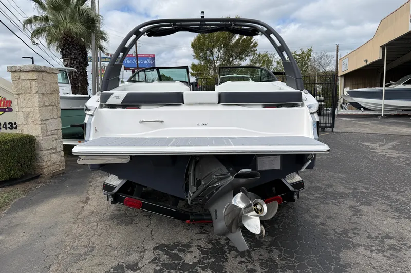 Slide: The Image of 2026 Regal LS2 boat rear view with propeller and swim platform. - 2