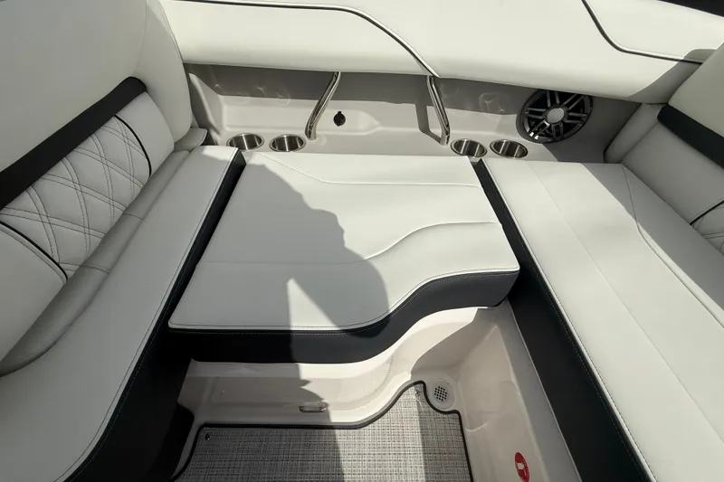 Slide: The Image of 2026 Regal LS2 boat interior with white leather seats and cup holders. - 21