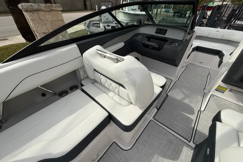 Slide: The Image of 2026 Regal LS2 boat interior with luxurious white seating and modern dashboard design. - 24