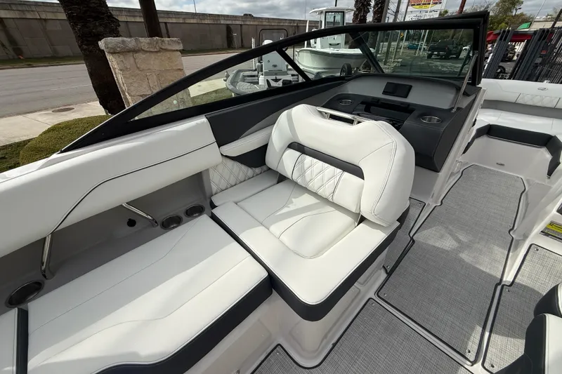Slide: The Image of 2026 Regal LS2 boat interior with white leather seating and modern dashboard design. - 25