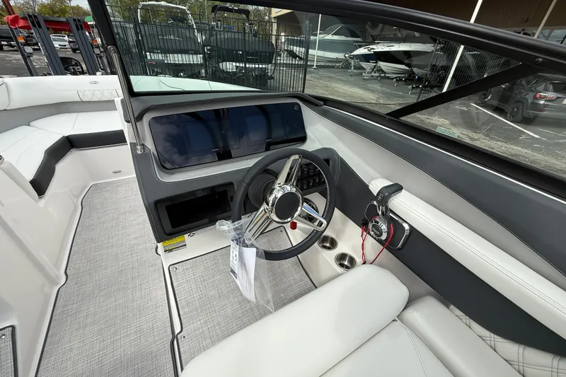 Slide: The Image of 2026 Regal LS2 boat interior with modern steering and dashboard controls. - 28