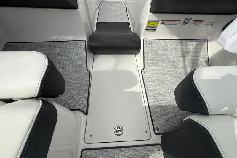 Slide: The Image of Interior of 2026 Regal LS2 boat with gray flooring and white seating. - 36