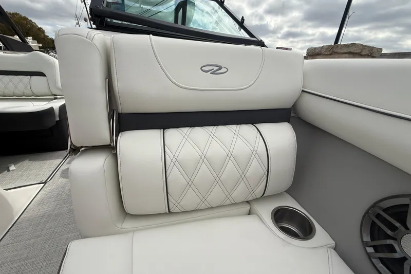Slide: The Image of Luxurious interior of 2026 Regal LS2 boat with white leather seating and cup holder. - 43