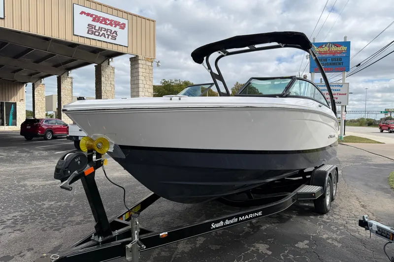 Slide: The Image of 2026 Regal LS2 boat on trailer at South Austin Marine dealership. - 5