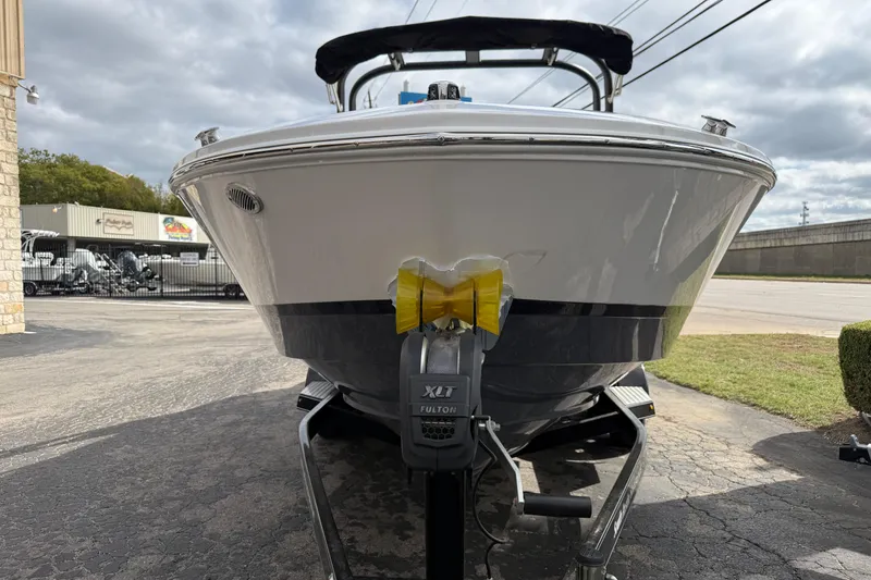 Slide: The Image of 2026 Regal LS2 boat on trailer, parked outdoors under cloudy sky. - 6