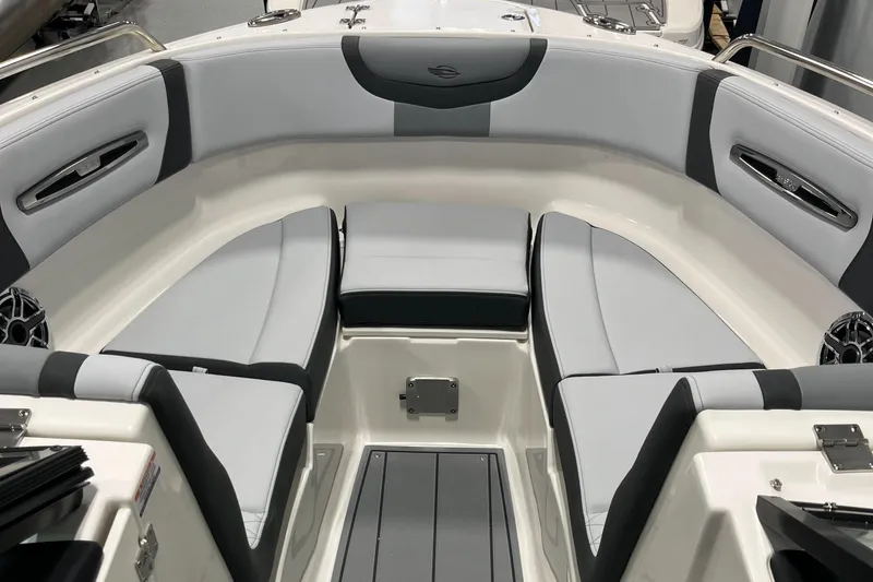 Slide: The Image of 2025 Chaparral 247 SSX boat interior with sleek gray seating and modern design. - 13