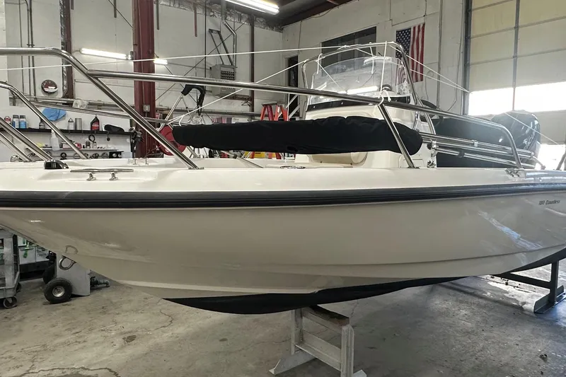 Slide: The Image of 2018 Boston Whaler 180 Dauntless boat in a workshop setting. - 3