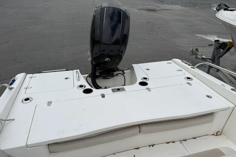 Slide: The Image of 2018 Boston Whaler 180 Dauntless boat with outboard motor, rear view. - 6