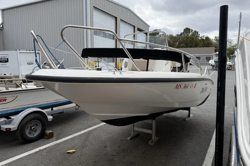 Slide: The Image of 2018 Boston Whaler 180 Dauntless boat on display at a marina. - 8