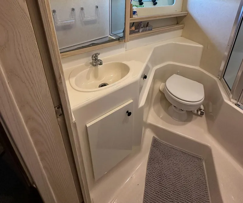Slide: The Image of Bathroom interior of 1995 Bayliner 4788 Pilothouse Motoryacht with sink and toilet. - 14