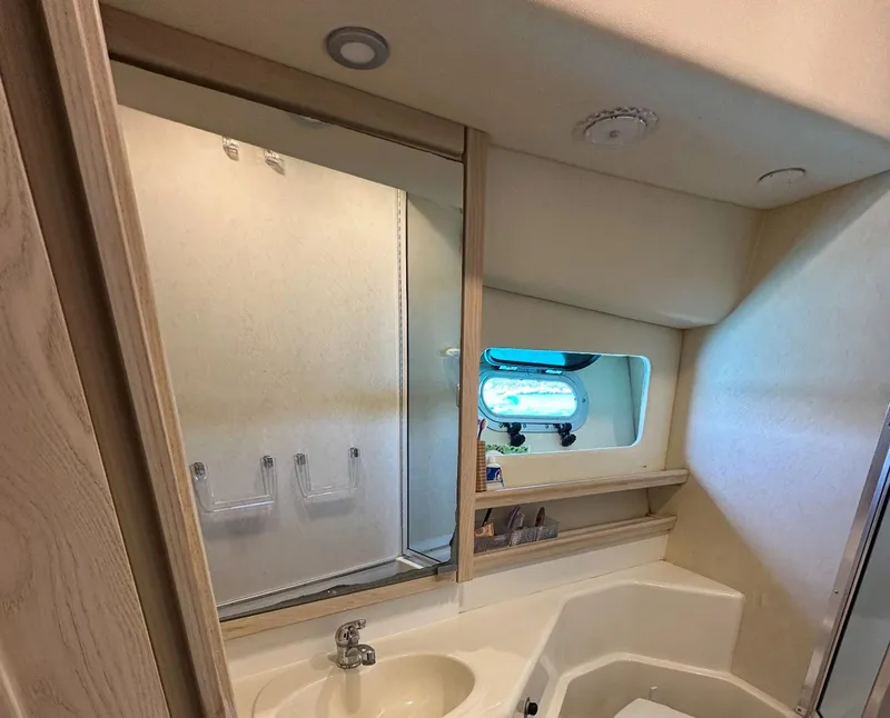Slide: The Image of Bathroom interior of 1995 Bayliner 4788 Pilothouse Motoryacht with sink and mirror. - 15