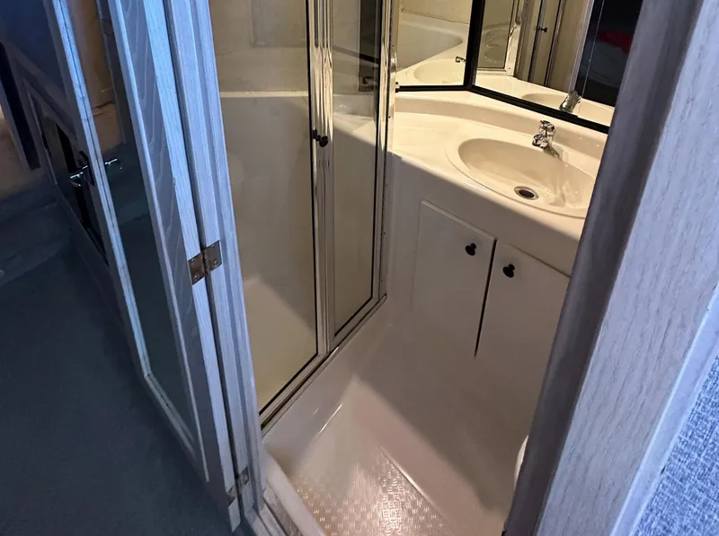 Slide: The Image of Bathroom interior of 1995 Bayliner 4788 Pilothouse Motoryacht with shower and sink. - 18