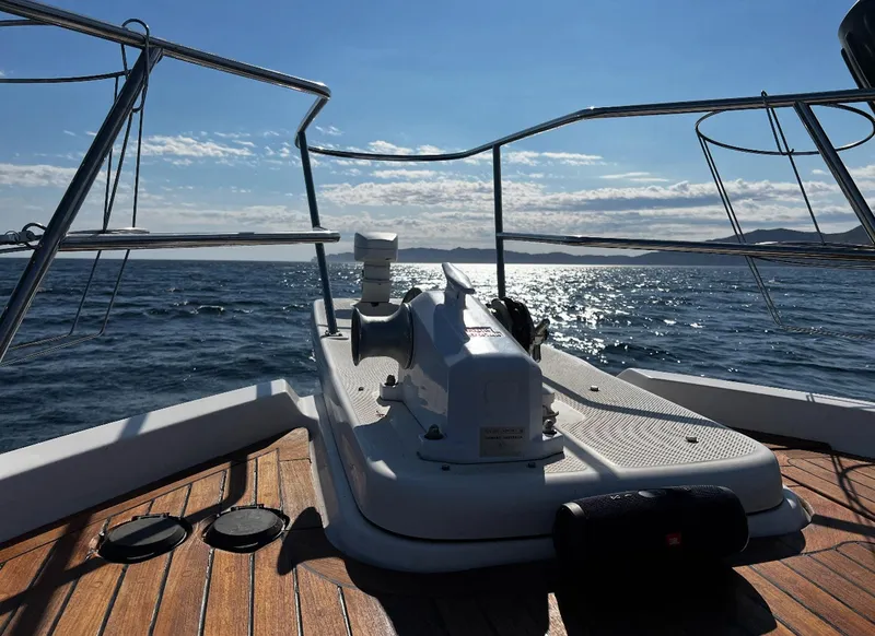 Slide: The Image of 1995 Bayliner 4788 Pilothouse Motoryacht deck with ocean view and clear sky. - 19