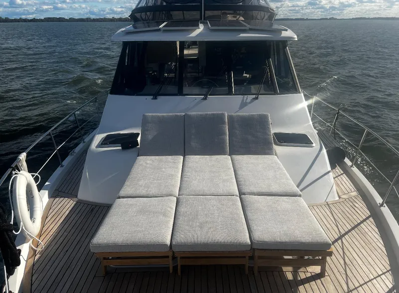 Slide: The Image of 1995 Bayliner 4788 Pilothouse Motoryacht with sun loungers on deck, cruising on open water. - 20