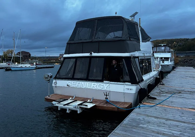 Slide: The Image of 1995 Bayliner 4788 Pilothouse Motoryacht docked at marina during dusk. - 27