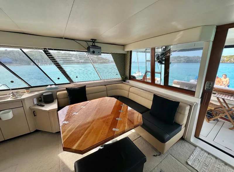 Slide: The Image of Interior of 1995 Bayliner 4788 Pilothouse Motoryacht with elegant seating and ocean view. - 3