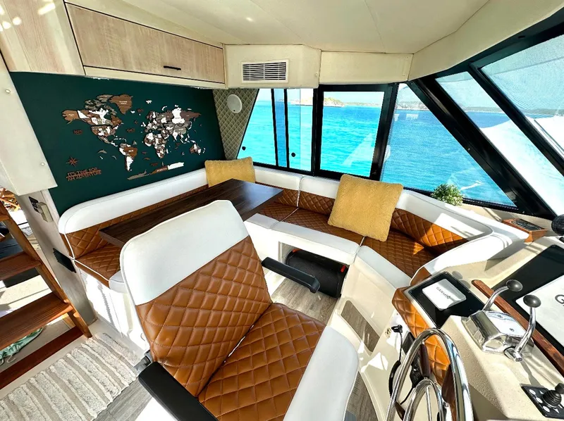 Slide: The Image of Luxurious interior of 1995 Bayliner 4788 Pilothouse Motoryacht with ocean view. - 6