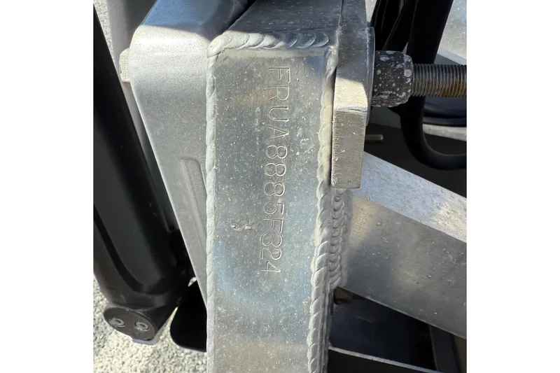 Slide: The Image of Close-up of a metal component with engraved serial number on a 2024 Berkshire 23E STS 3.0. - 19