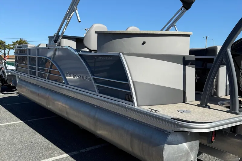 Slide: The Image of 2024 Berkshire 23E STS 3.0 pontoon boat, saltwater edition, parked outdoors. - 7