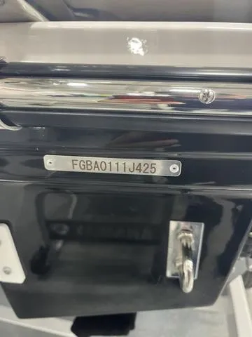 Slide: The Image of 2025 Chaparral 23 Surf boat with visible serial number plate. - 13