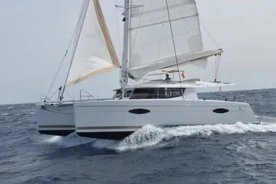 The Image of 2015 Fountaine Pajot Helia Maestro catamaran sailing on open sea. - 0
