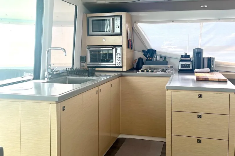 Slide: The Image of Modern kitchen interior of 2015 Fountaine Pajot Helia Maestro catamaran with appliances and cabinetry. - 11
