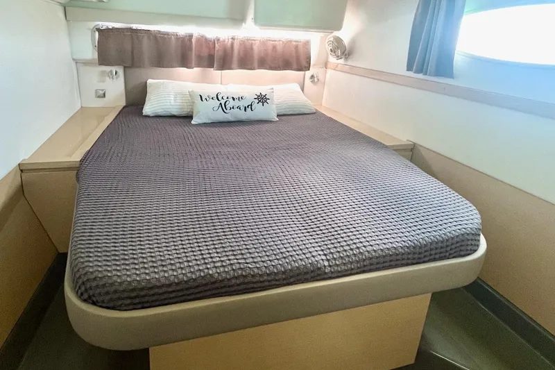 Slide: The Image of Cozy bedroom in 2015 Fountaine Pajot Helia Maestro catamaran with "Welcome Aboard" pillow. - 12