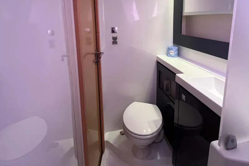 Slide: The Image of Bathroom interior of 2015 Fountaine Pajot Helia Maestro catamaran, featuring modern fixtures. - 14
