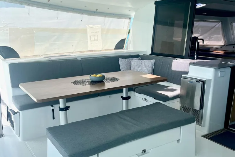 Slide: The Image of Luxurious interior of 2015 Fountaine Pajot Helia Maestro catamaran with modern seating and dining area. - 3