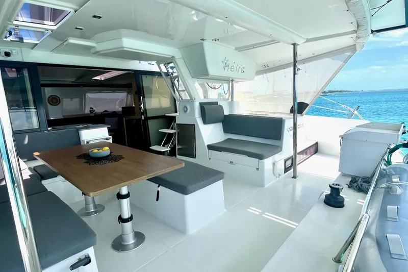 Slide: The Image of Spacious 2015 Fountaine Pajot Helia Maestro yacht deck with seating and dining area. - 5