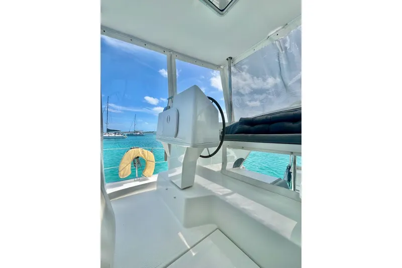 Slide: The Image of Helm of 2015 Fountaine Pajot Helia Maestro catamaran with ocean view. - 7