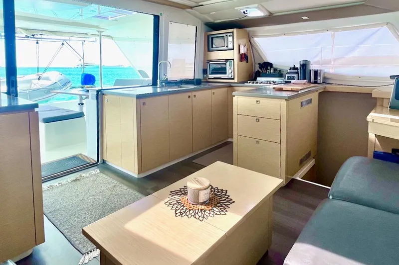 Slide: The Image of Luxurious interior of 2015 Fountaine Pajot Helia Maestro catamaran with modern kitchen and ocean view. - 9