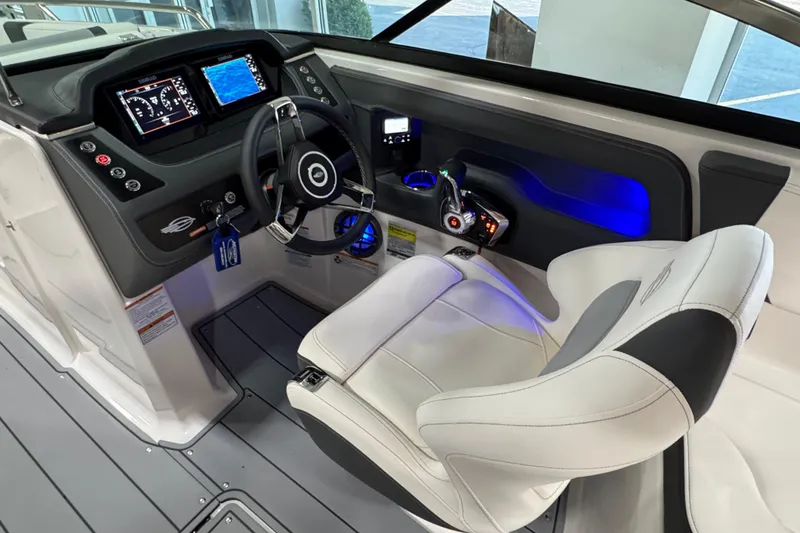 Slide: The Image of 2025 Chaparral 247 SSX boat cockpit with modern steering and digital displays. - 11