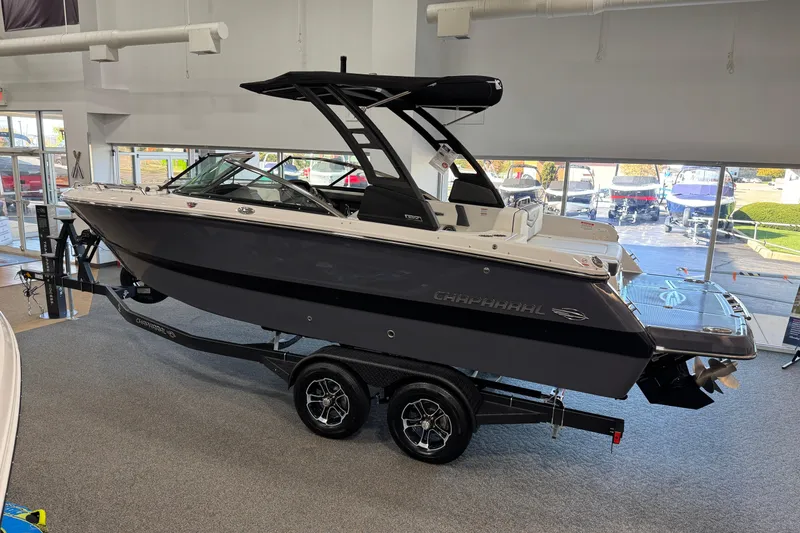 Slide: The Image of 2025 Chaparral 247 SSX boat displayed indoors on a trailer. - 3