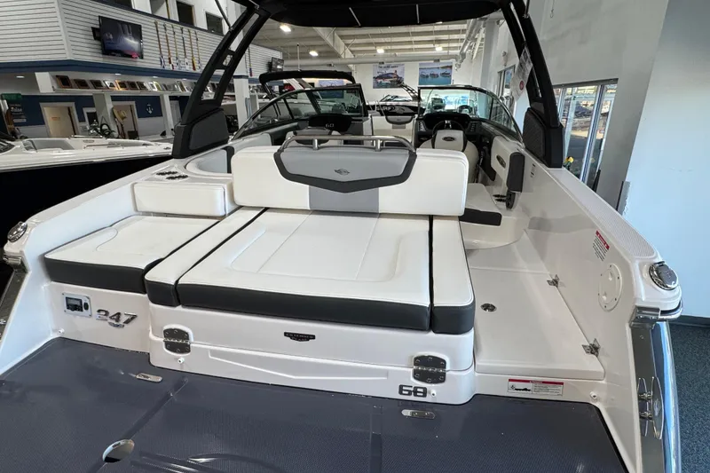 Slide: The Image of 2025 Chaparral 247 SSX boat interior with white seating and modern design. - 5