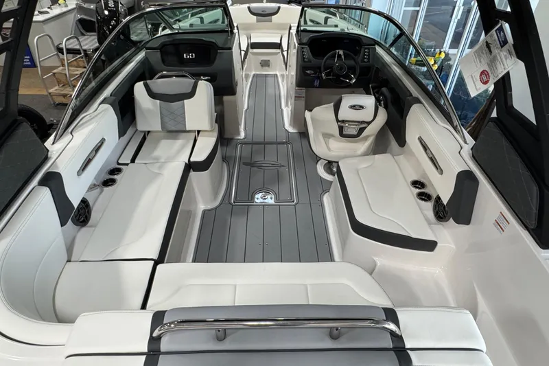 Slide: The Image of 2025 Chaparral 247 SSX boat interior with sleek seating and modern dashboard design. - 6