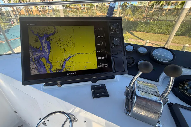 Slide: The Image of Helm of 1987 Hi-Star 55 Yacht Fisherman with Garmin GPS and engine controls. - 12