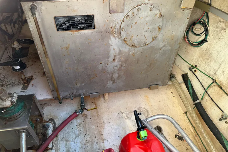 Slide: The Image of Engine room of 1987 Hi-Star 55 Yacht Fisherman with fuel tank and hoses. - 20