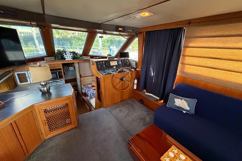 Slide: The Image of Interior of 1987 Hi-Star 55 Yacht Fisherman with helm, seating, and nautical decor. - 27