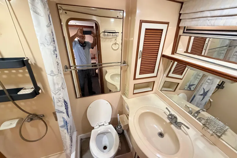 Slide: The Image of Bathroom interior of 1987 Hi-Star 55 Yacht Fisherman with sink, toilet, and shower. - 41